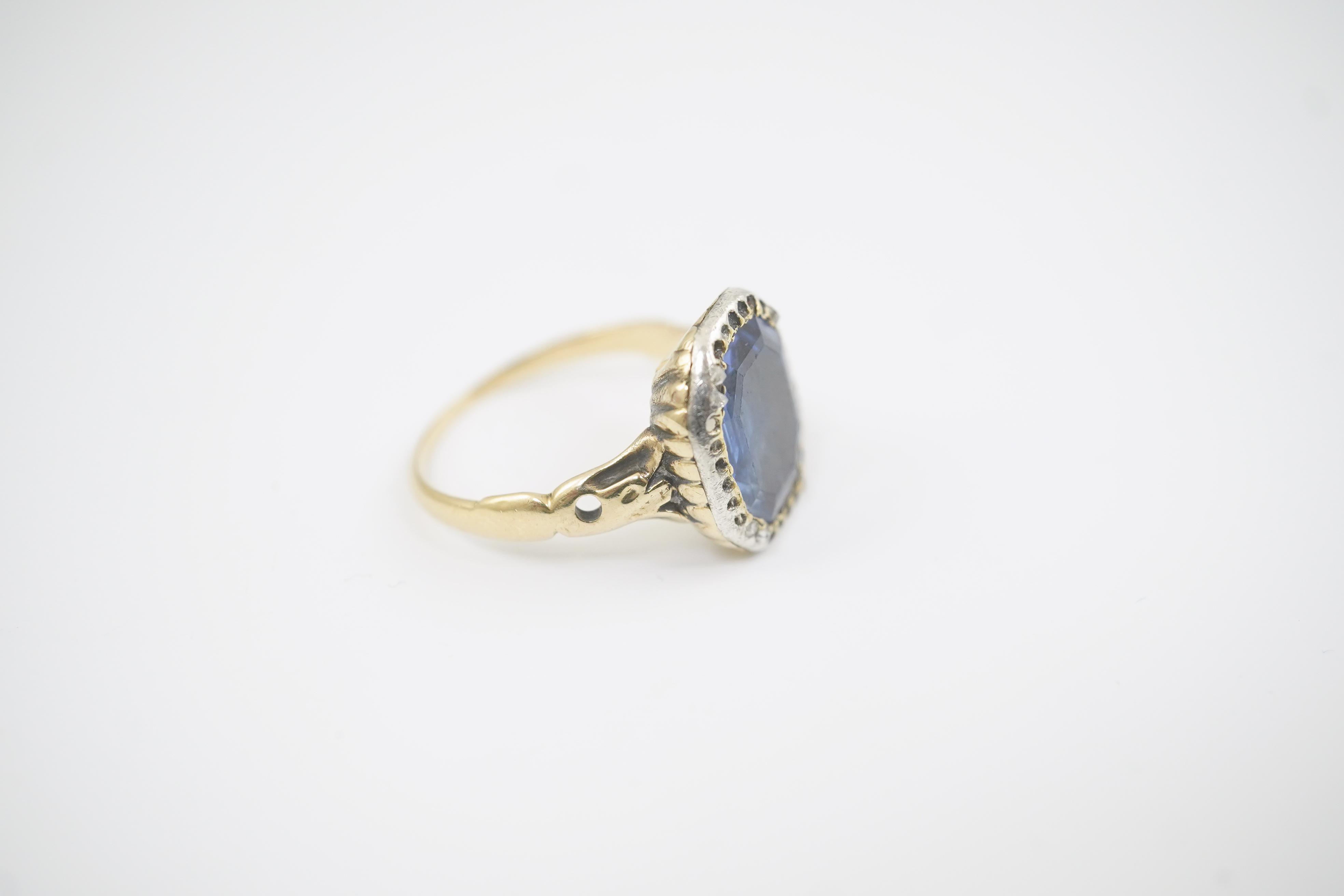 A Georgian gold and single stone collet set octagonal cut sapphire set ring